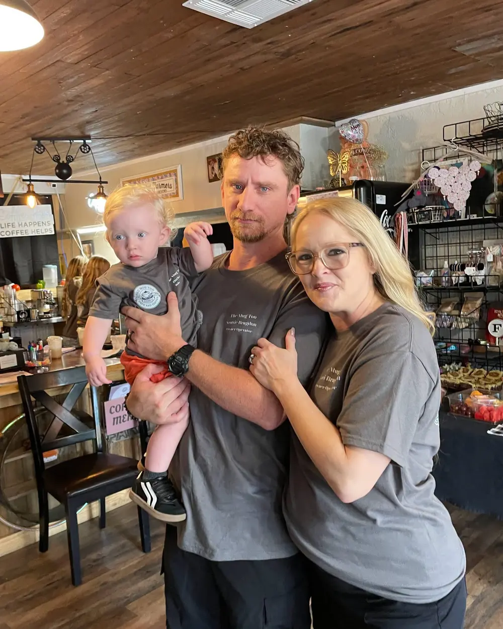 Scottie and Lori Bragdon with their son inside The Mug Too
